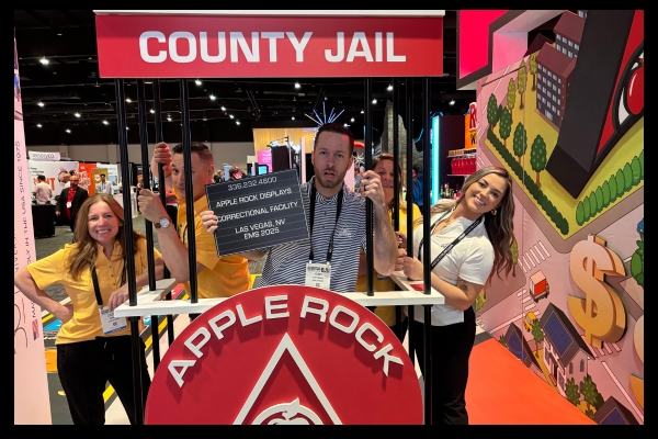 County Jail-themed photo backdrop at Apple Rock’s ExhibitorLive and EMS gamified exhibits, part of interactive scavenger hunt.