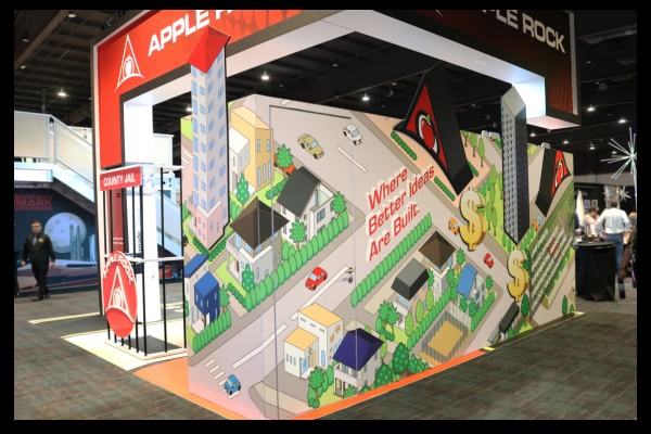 Apple Rock branding and signage at ExhibitorLive and EMS live events, showcasing gamified exhibit experience.