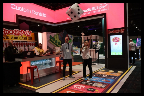 Giant inflatable dice used in Apple Rock’s gamified exhibit experience at ExhibitorLive and EMS events.