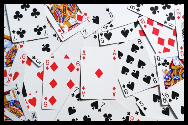 Spread of playing cards illustrating strategic gamification elements for live exhibits and events.